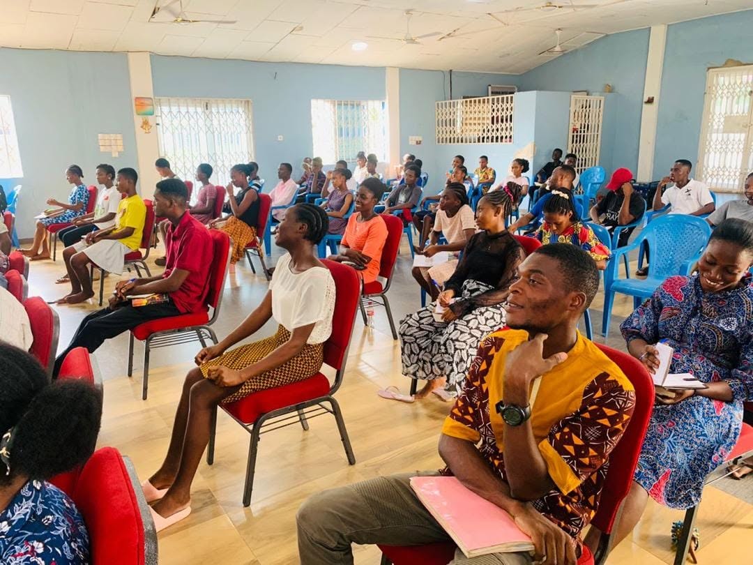 People listening during a Hope Hills Mission teaching session