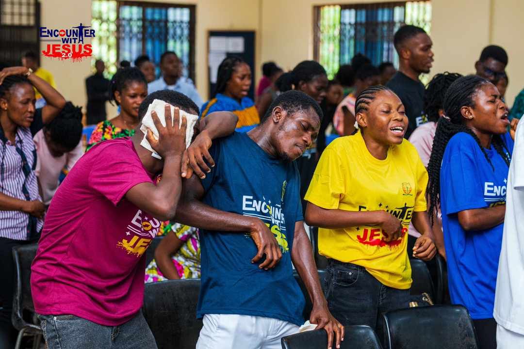 People praying together at a ministry event
