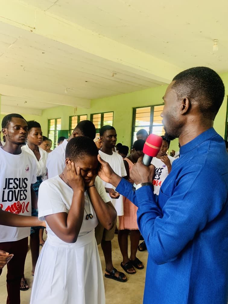 Prayer during a school outreach